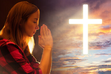 Praying woman. Religious woman. Christian cross among the clouds. Lighting catholic cross in sky....
