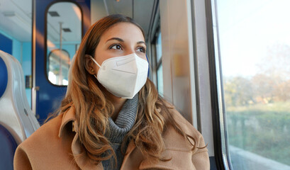 Travel safely on public transport. Panoramic banner of beautiful woman wearing FFP2 KN95 face mask...