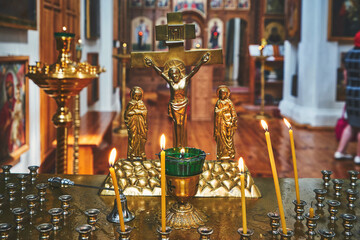 Orthodox shrine with crucifixion cross and candles