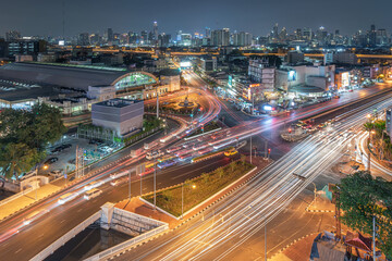 Bangkok cityscape in Thailand. View of Rama 4 road with cross junction at nigh time.