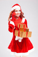 Christmas and New Year Concepts. Smiling Happy Snow Maiden with Lots of Beautifully Packed Christmas Presents Talking on Cellphone Against White.