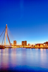 Tranquil Night View of Renowned Erasmusbrug (Swan Bridge) in  Rotterdam in Front of Port with Harbour. Shoot Made At Dusk.