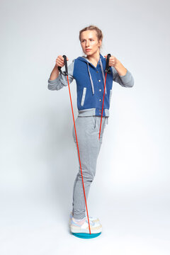 Caucasian Female Athlete Posing on Body Spinner Using Flexible Ropes For Exercise