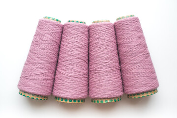 Bobbins with yarn on a white background. Colored yarn. 
