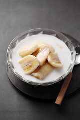 Thai dessert from banana and coconut milk in glass cup