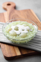 Sticky rice and longan pudding in glass cup on tray