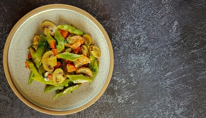 Round plate with stewed green beans, carrots, onions and olive oil.l on a dark background