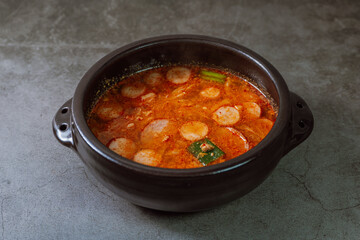 Buddaejjigae, Korean style spicy stew of wieners, luncheon meat, macaroni and vegetables.