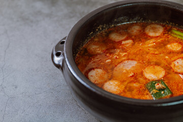 Buddaejjigae, Korean style spicy stew of wieners, luncheon meat, macaroni and vegetables.