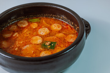 Buddaejjigae, Korean style spicy stew of wieners, luncheon meat, macaroni and vegetables.