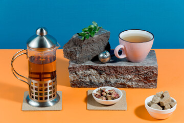 Tea with dessert on a bright colored background 