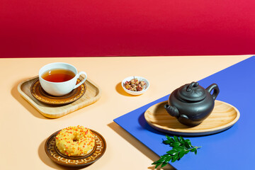 Tea with dessert on a bright colored background 