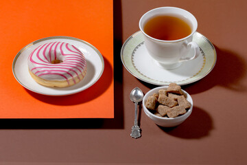 Tea with dessert on a bright colored background