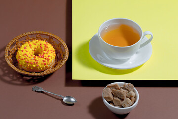 Tea with dessert on a bright colored background 