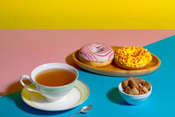 Tea with dessert on a bright colored background