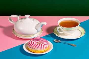 Tea with dessert on a bright colored background 