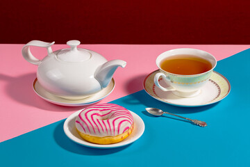 Tea with dessert on a bright colored background 