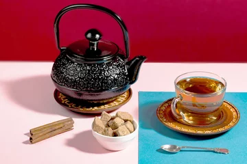 Foto op Aluminium Tea with dessert on a bright colored background  © vizafoto