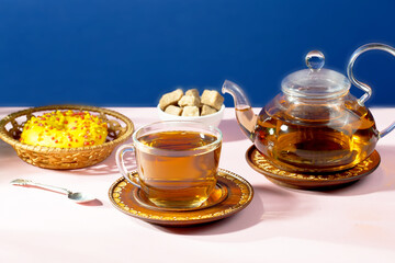 Tea with dessert on a bright colored background 