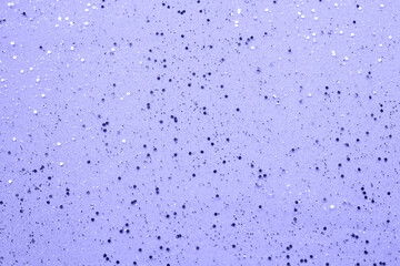 Vivifying violet sprinkles background. Festive holiday background.