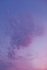 Beautiful sky background at sunset in pastel purple pink blue color palette - trendy very peri color shade