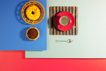 Coffee with dessert on a bright colored background 