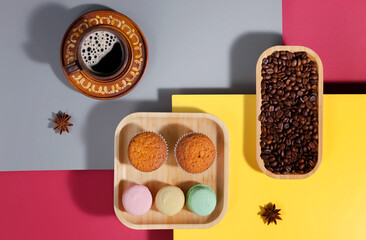 Coffee with dessert on a bright colored background 