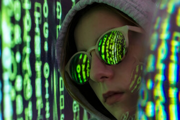 Female teenager with coding reflection on eyeglasses