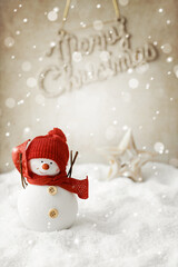 christmas snowman and ornaments in the snow. christmas greeting card