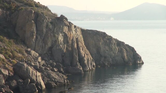 Look at rocks and the Crimean mountains along the Black Sea coast from Galitsyn trail. Calm life in Crimea afte return of peninsula to its native harbor. Russia Crimea 2014.
