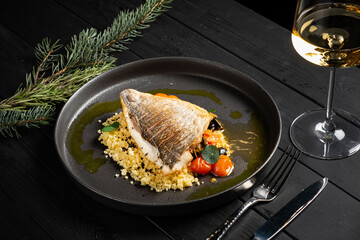  Fried fish on a plate with lemon butter sauce