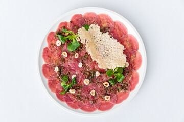 gourmet carpaccio with walnut  and parmesan