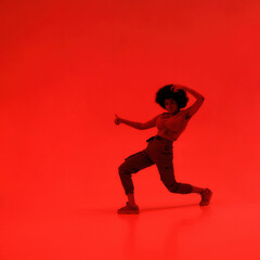 Fototapeta na wymiar Young female dancer dancing hip hop dance