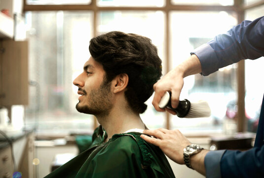 Head of male customer sitting in Barber Shop