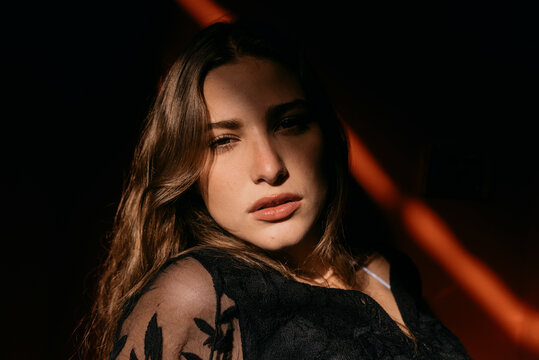 Sensual young beautiful woman with sunlight on face