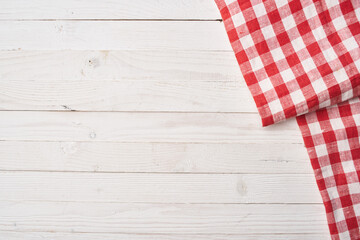 Fototapeta na wymiar Red checkered tablecloth wooden background texture kitchen decoration