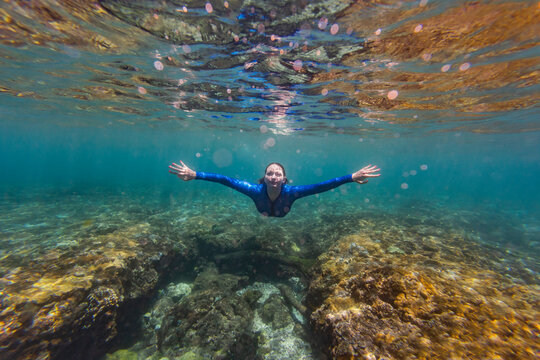 Indonesia, Bali, Young woman snorkeling in Nusa Penida island
