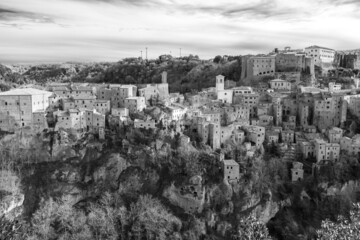 Sorano, Tuscany, Italy. Black and white landscape of the picturesque medieval town founded in Etruscan time on the tuff hill