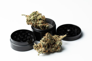 Metallic black grinder with buds of marijuana, weed cannabis, medical marijuana