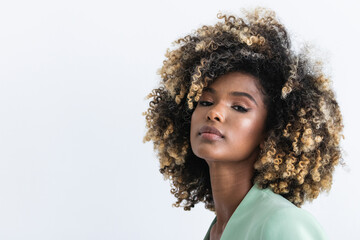 Young businesswoman with highlights hair in studio