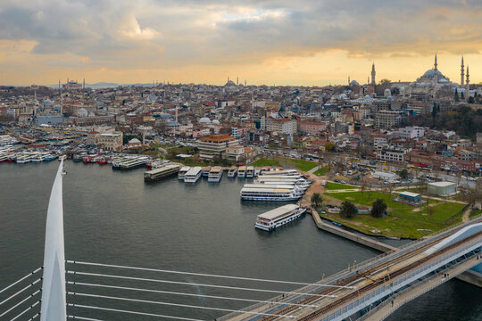 Turkey, Istanbul, Aerial view of Golden Horn Metro Bridge and boats moored in harbor