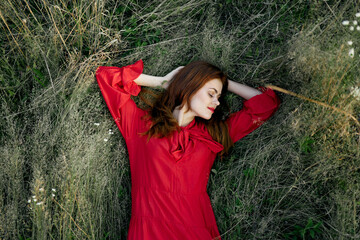 woman in red dress nature green grass landscape rest