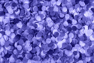 Festive purple confetti background. Flat lay style.