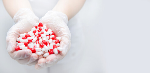 hands in white gloves with tablets