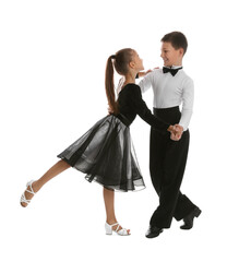 Beautifully dressed couple of kids dancing on white background