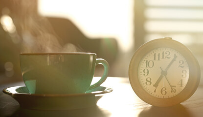 Morning at seven o'clock. Clock and a cup of tea.