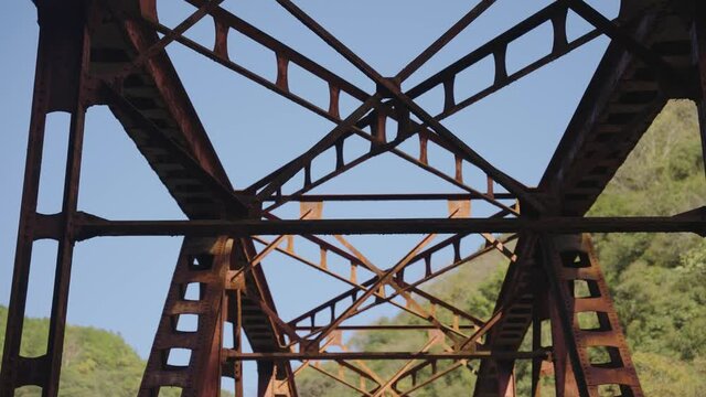 Red Iron Bridge Rusting, Standing Against the Sky of Hyogo Mountains, Japan