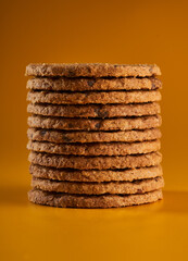 Oat biscuits on yellow background