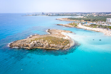 Fototapeta na wymiar Aerial view of the most famous beaches in Cyprus - Nissi Beach. White sand beach with azure waters. Beautiful beach and panoramic views of Cyprus