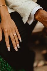 Obraz premium bride and groom holding hands